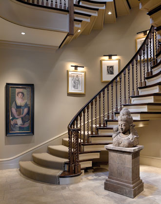 A series of drawings, etchings, and lithographs by Matisse, Bissière, and Toulouse-Lautrec—all of them portraits made in the 1920s, and with stylistic elements common to the period—line the stairway wall in this Lincoln Park residence. They strike an intimate moment in this four-story, 15,000-square-foot (1,394-square-meter) home. The bust of Shiva is from Indonesia. From Suzanne Lovell's "Artistic Interiors: Designing with Fine Art Collections"